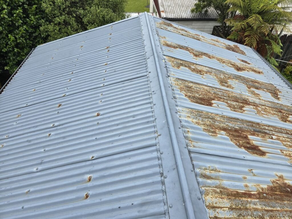 Rusted iron on a garage roof before replacement