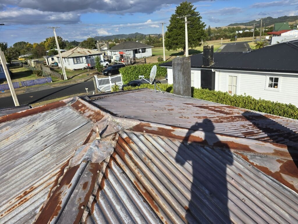 Rusted corrugated iron roof in Huntly before the reroof